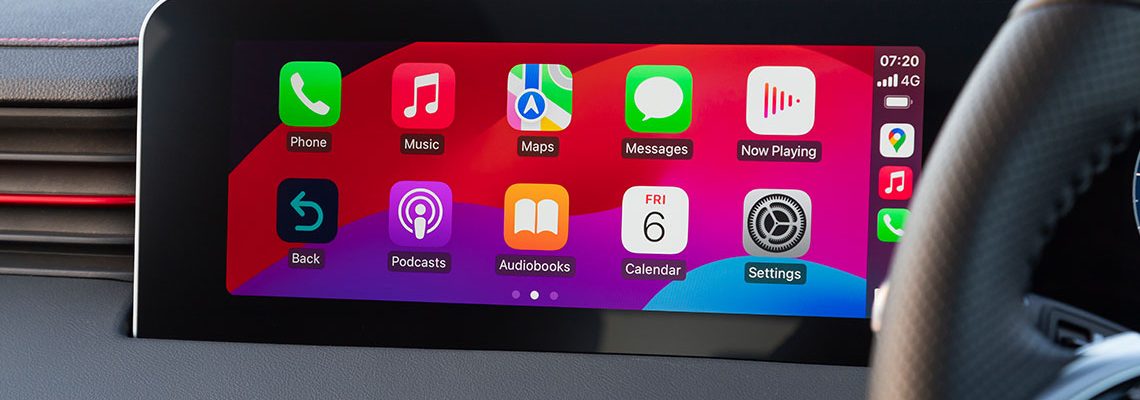 Car dashboard screen displaying colorful app icons like Phone, Music, Maps, and Settings. The design is vibrant, modern, and user-friendly.